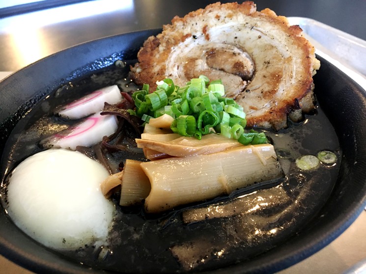 Tora Ramen's black tonkotsu broth gets its color from squid ink and black garlic. - MARK ANTONATION