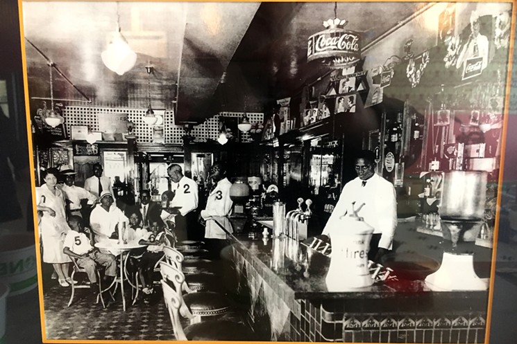 Sherry's Soda Shoppe owner Joshua Pollack was given this photo of an old Five Points soda fountain. - MARK ANTONATION