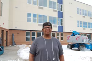 Christopher Hampton helped moved furniture into PATH, the affordable-housing complex that ended his four-and-a-half-year experience with homelessness. - SARA FLEMING