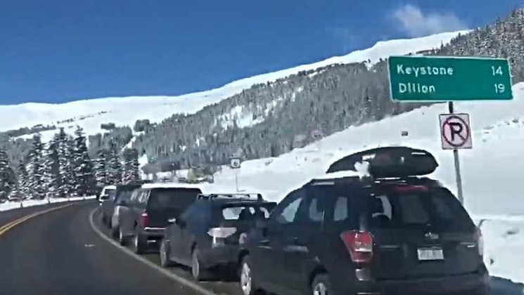 Cars were parked along the highway to Loveland Pass for miles last weekend, as seen in another screen capture from the @officialsnowdog Twitter video. - @OFFICIALSNOWDOG