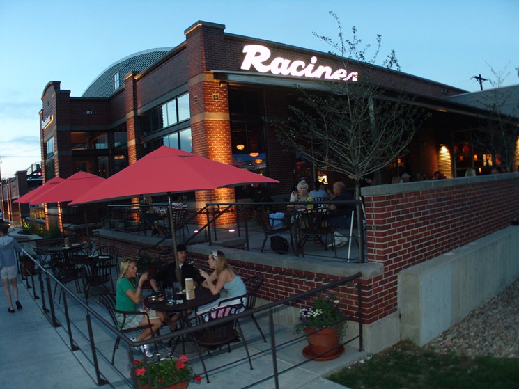 The Racines patio became a popular gathering spot. - LARRY LASZLO