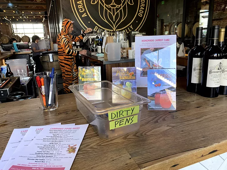 Chad Yetka keeps things light at the bar even while maintaining safe serving conditions. - LEIGH CHAVEZ BUSH