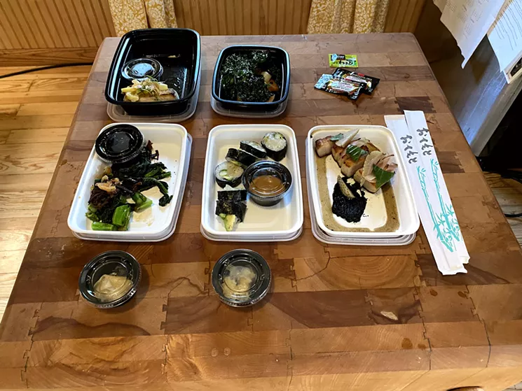 An array of Uchi happy hour sushi and other dishes ready turns my living room into a Japanese restaurant. - LEIGH CHAVEZ BUSH