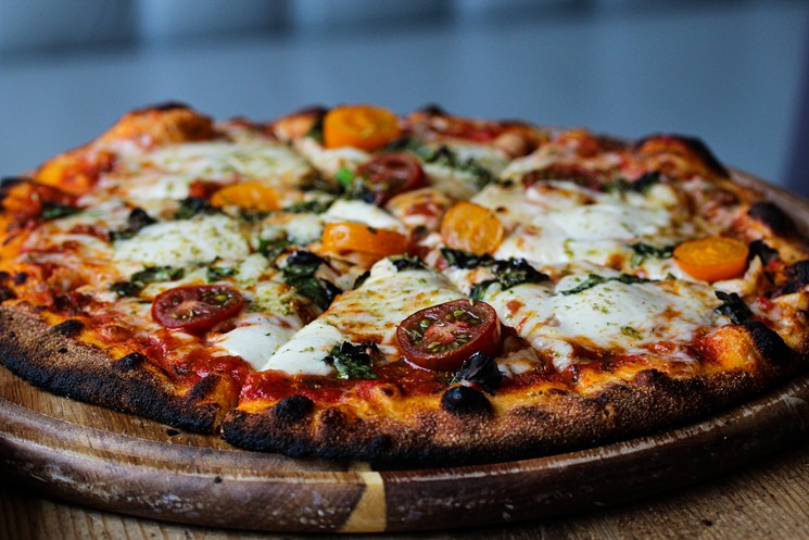 Wood-fired pizzas are on the menu for takeout. - COURTESY OF THE KITCHEN UPSTAIRS