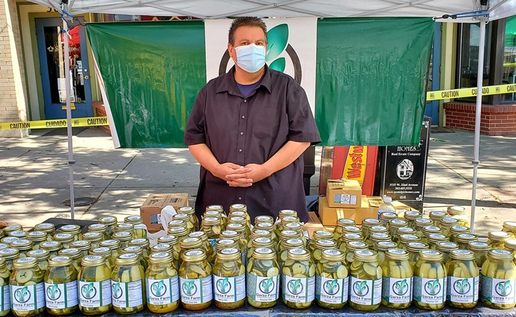 Rick Garza sells his brother's pickles at the Highland Farmers' Market. - LINNEA COVINGTON