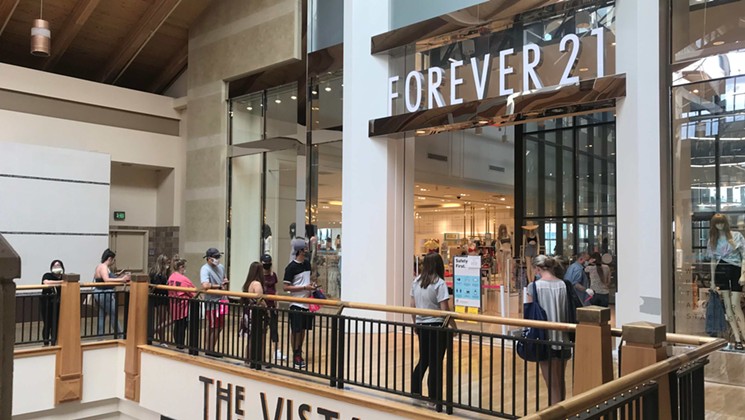 Customers lined up to gain entry to Forever 21. - PHOTO BY MICHAEL ROBERTS