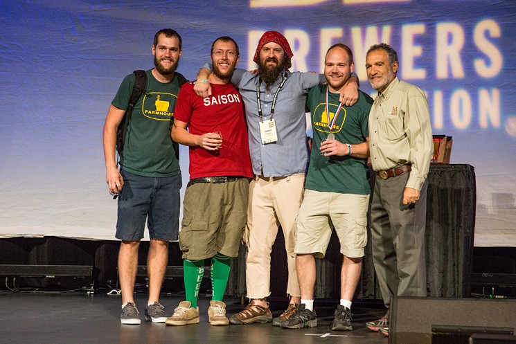 Jason Yester, center, on stage after winning a medal for Red Swingline at GABF. - BREWERS ASSOCIATION