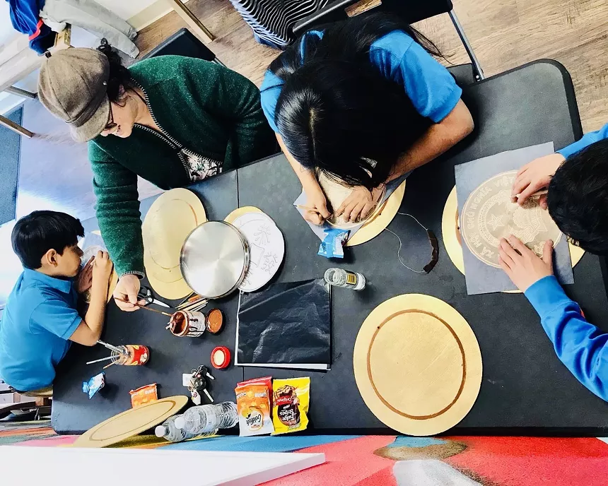 Mari Munet working with children from Westwood and the Boys and Girls Club during a Community Art Day in January. - VICTOR NGO-SMITH