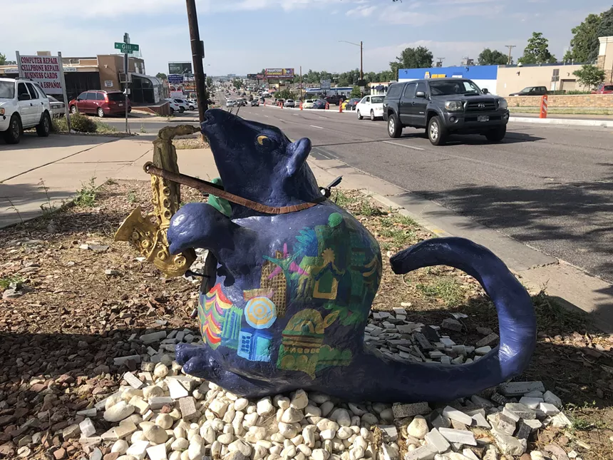 The saxophonist rat is painted with skylines from the Philippines, Singapore, Vietnam, and Denver, and utilizes components of sacred geometry. - CLEO MIRZA
