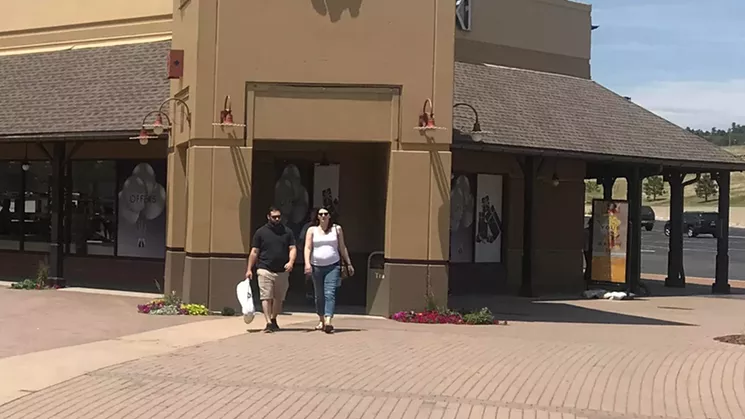 At the Castle Rock factory outlet shops, many customers removed their mask as soon as they stepped outside. - PHOTO BY MICHAEL ROBERTS
