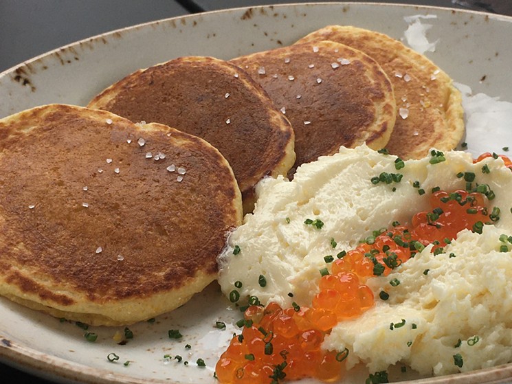 Corn cakes with house-cultured butter and trout roe. - MARK ANTONATION