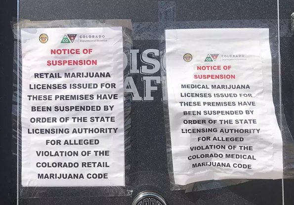 Suspension orders from the MED, seen here at Botanico's store at 777 Canosa Court, are posted at both dispensaries. - THOMAS MITCHELL