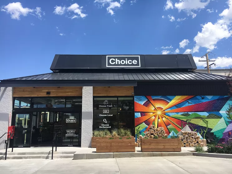 The Colorado sun shines from a mural on the side of the new Colfax Avenue Choice Market. - MARK ANTONATION
