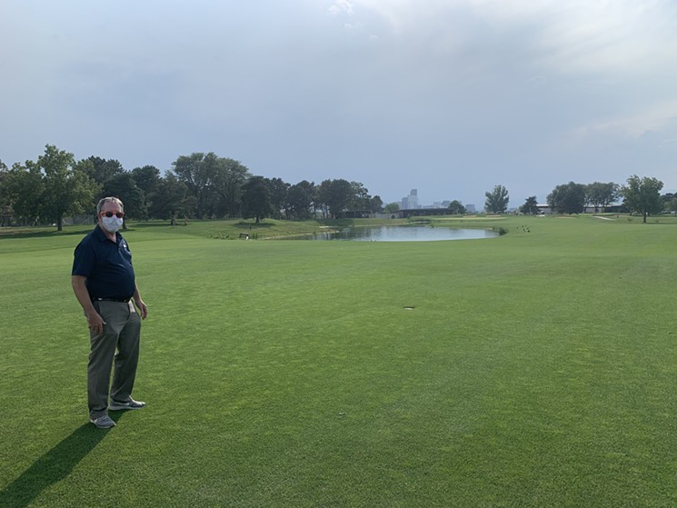Denver Golf director Scott Rethlake in front of a body of partially treated water that will be used to irrigate the course. - CONOR MCCORMICK-CAVANAGH