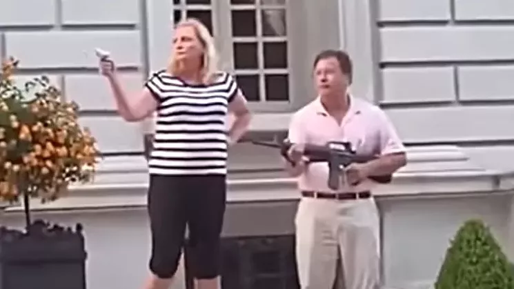 The McCloskeys outside of their St. Louis home. - NEWSY VIA YOUTUBE