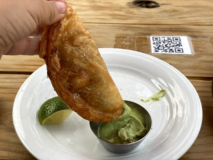 I know there's chicken inside this empanada, but otherwise it's a mystery. - LEIGH CHAVEZ BUSH