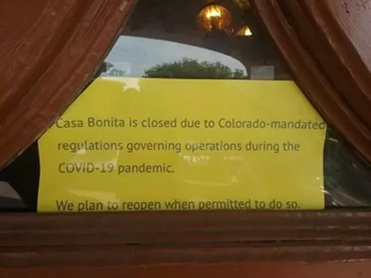 A sign in the window gives us hope that Casa Bonita will one day welcome back packs of marauding toddlers and their parents. - WESTWORD