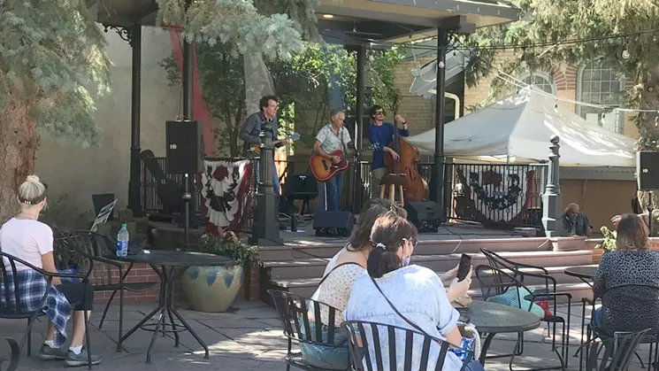 Socially distanced patrons enjoying live music in Georgetown on September 12. - PHOTO BY MICHAEL ROBERTS