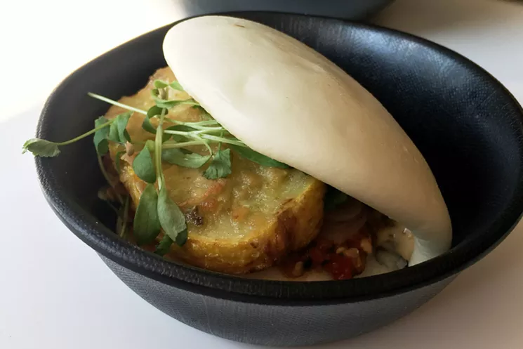 Along with pork belly and spicy chicken bao, Pig & Tiger offers a seasonal veggie bao; this one is tempura summer squash. - MARK ANTONATION