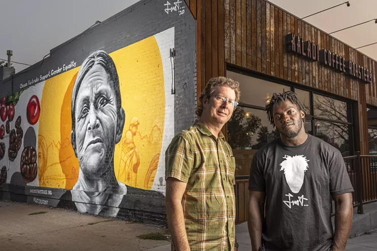 Kaladi Coffee Roasters owner Mark Overly and mural artist Giovannie AKA Just in front of the completed "Choose Fairtrade: Choose the World You Want" mural. - MARK LEFFINGWELL