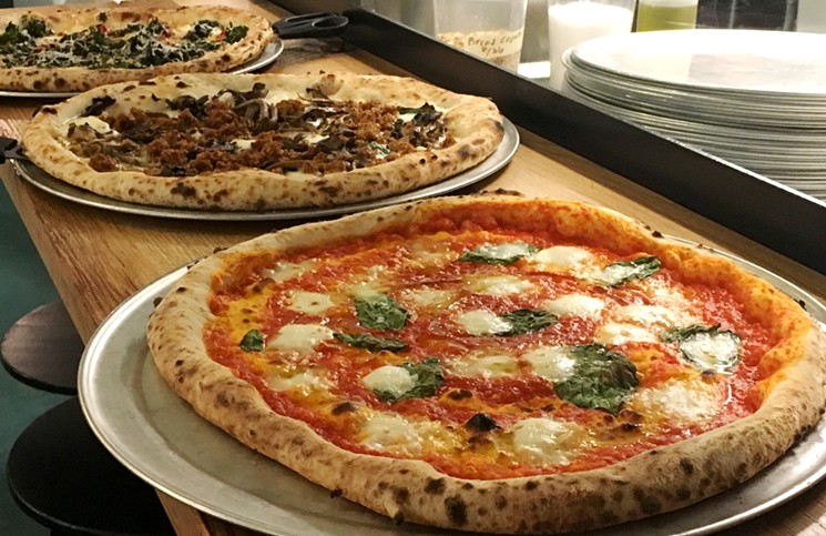 Fringe Pizza is back to slinging pies in Boulder. - MARK ANTONATION