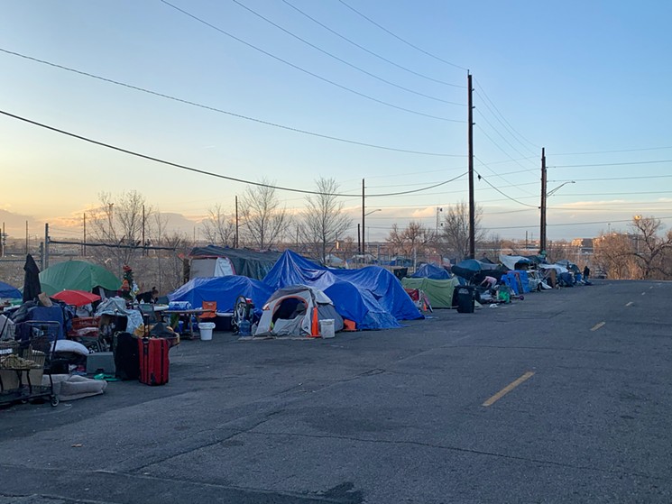 The large homeless encampment wrapped around an empty plot of land in RiNo. - CONOR MCCORMICK-CAVANAGH