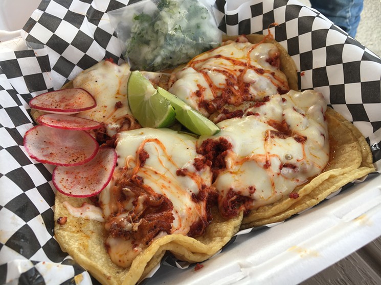 These cheesy chorizo tacos from La Carpa are trending up in the Mexican street food scene. - MARK ANTONATION
