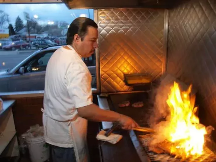 The Columbine cooks (seen here before the pandemic) cook up a mean flame-grilled steak. - WESTWORD STAFF