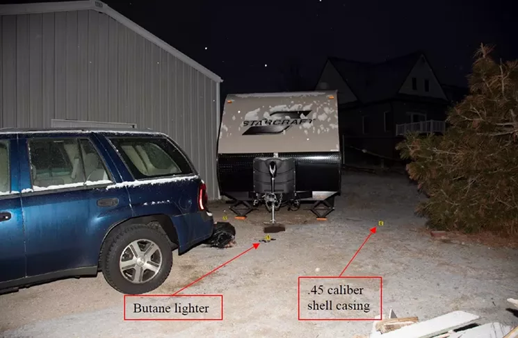 A photo from the scene of the shooting shows the location of the butane lighter and the shell casing. - 17TH JUDICIAL DISTRICT DA'S OFFICE