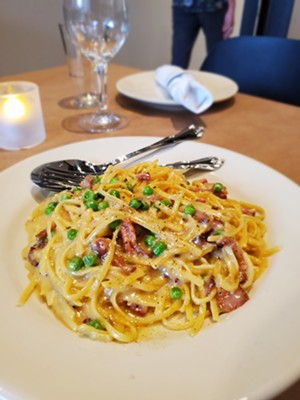 The carbonara is made with cream and butter. Its not traditional, but it is rich and delicious. - MOLLY MARTIN