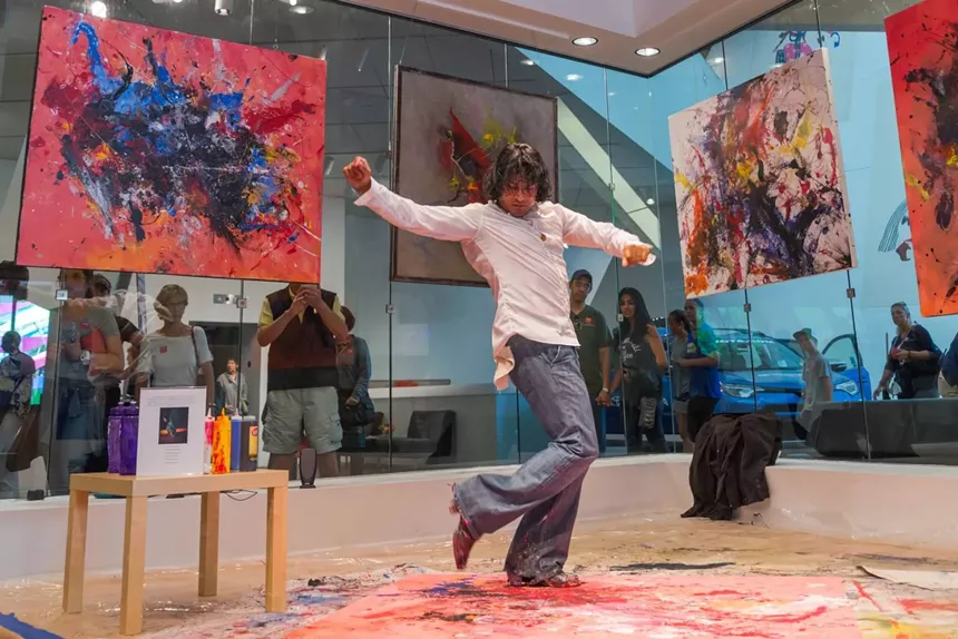 Rudi Monterroso paints with his feet, using his concept of Mindful Movement. - COURTESY OF RUDI MONTERROSO