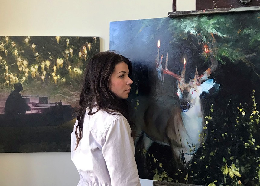 Mia Bergeron with two fresh paintings. - MIA BERGERON