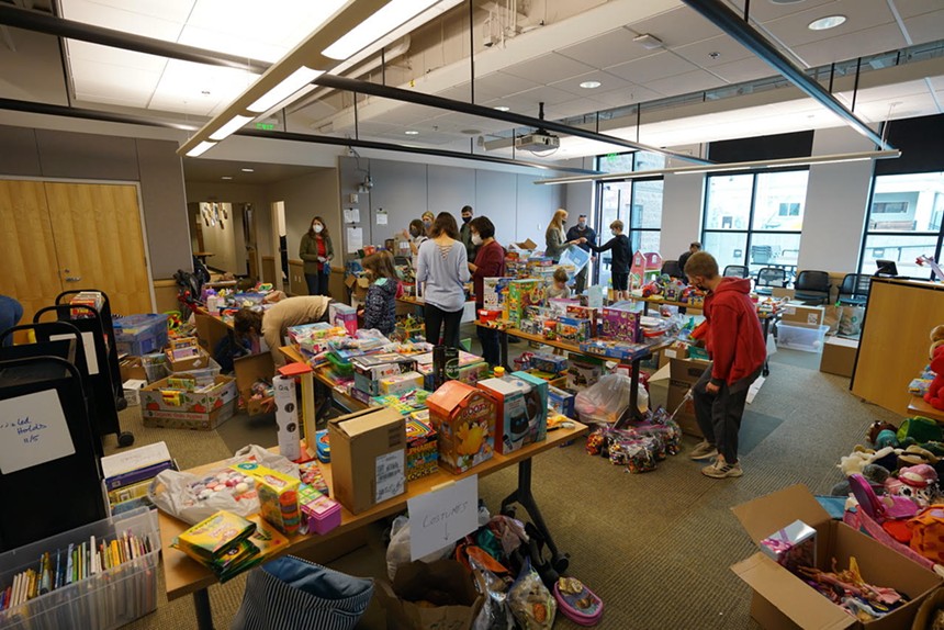 Donations fill the Louisbile PUblic Library. - DUSTIN BAILEY