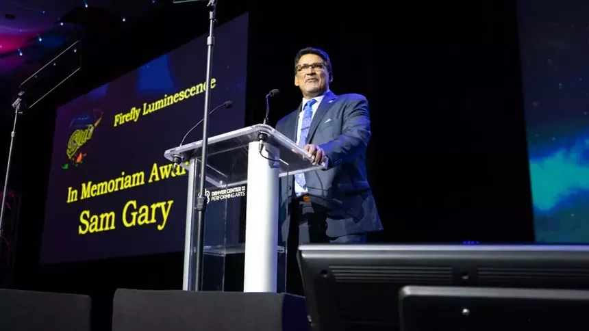 Jesse Ogas at the lectern. - COURTESY OF JESSE OGAS, VIA 9NEWS