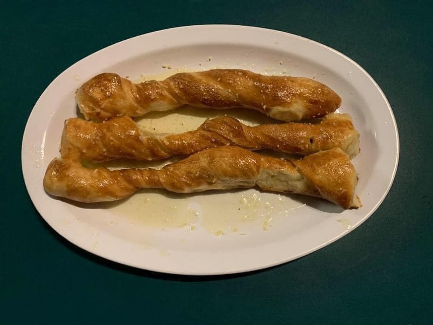 The iconic breadsticks, which come covered in garlic butter. - OBLIO'S PIZZERIA