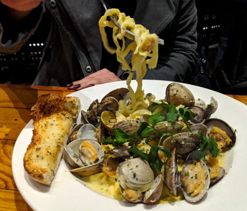 You might catch a clams and linguine special on mollusk Mondays at Angelo's. - ANGELO'S TAVERNA/INSTAGRAM