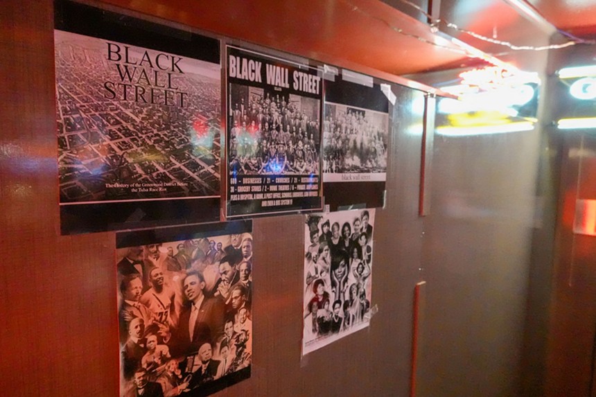 Posters are taped to the wall at Mr. A's. - JAKE BROWNE