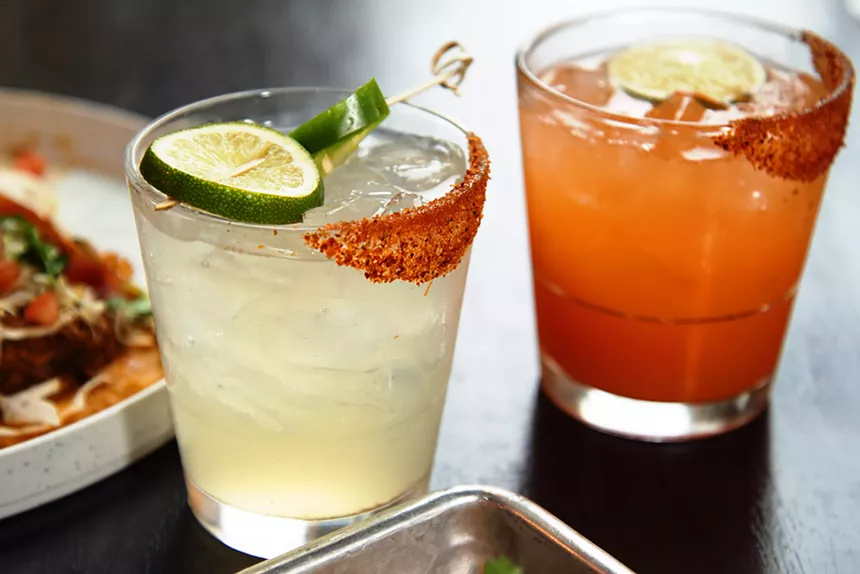 The jala-piña, left, and the carrot mole margaritas were crafted with help from bar manager, Daniel Farias. - TOM HELLAUER