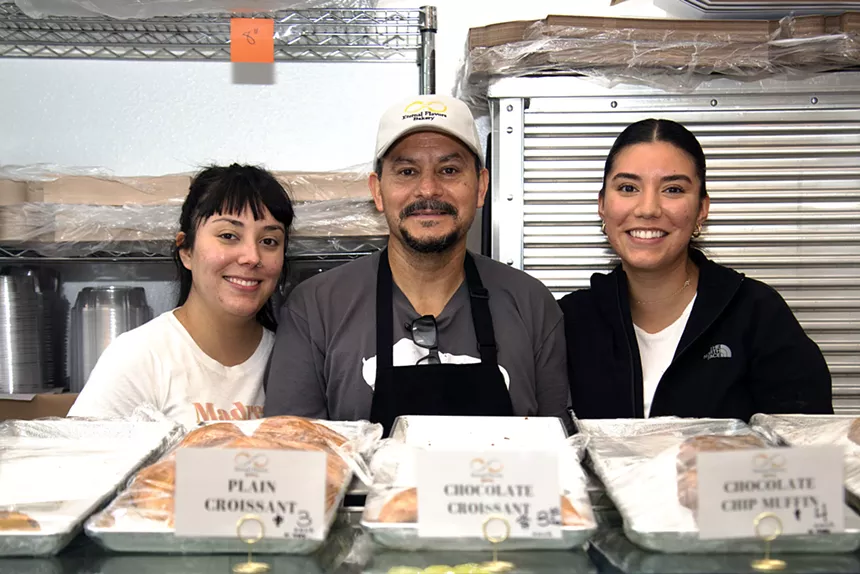 Melchor Ocampo, center, works with his two daughters, Ruth Simonson, left, and Fatima Ocampo. - TOM HELLAUER