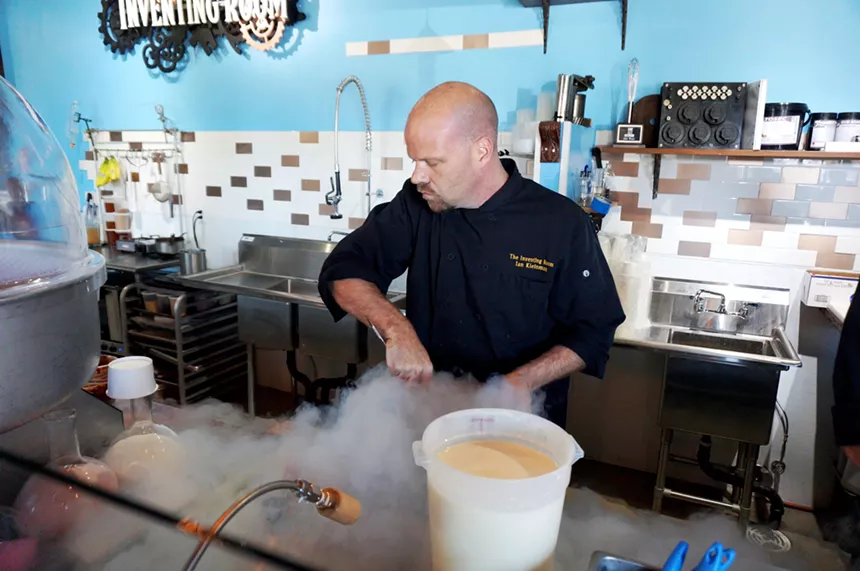 a man in a chef's coat using dry ice
