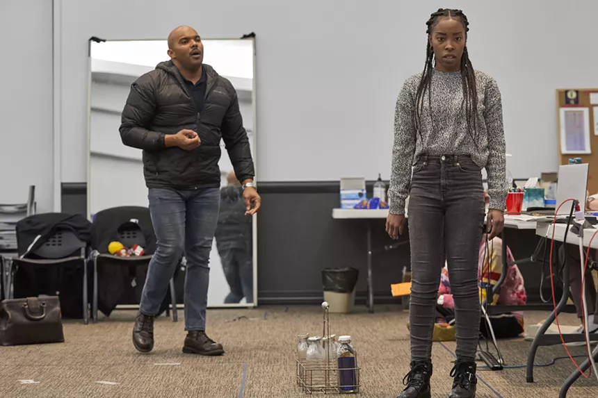 two actors rehearse in a rehearsal room