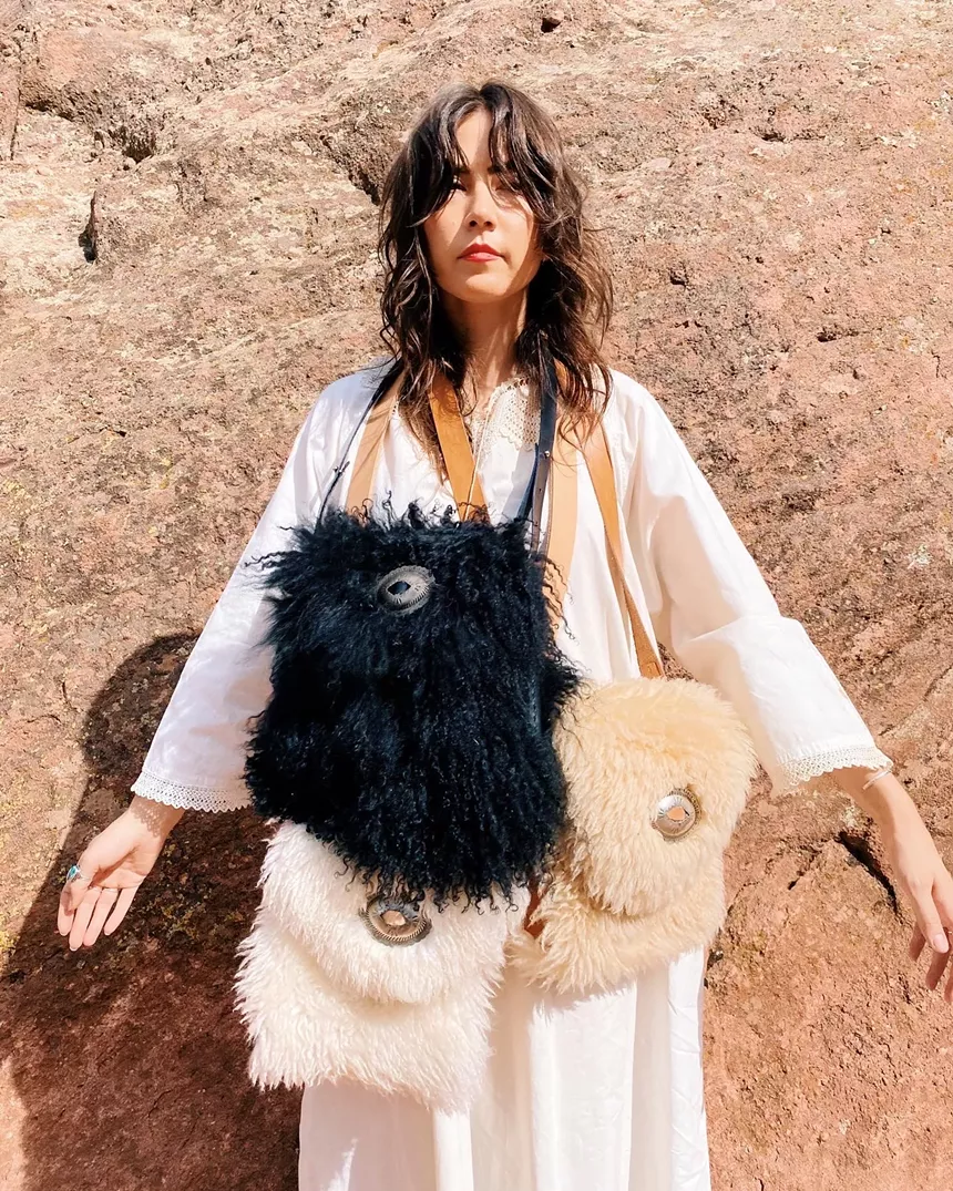 woman carrying bags