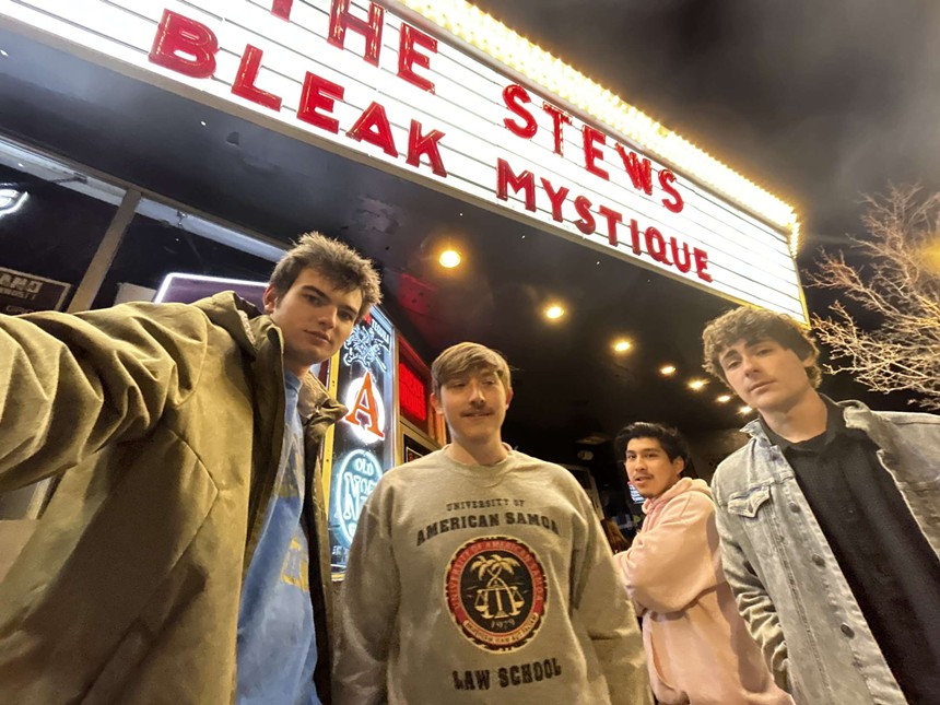 Aidan Hutchings, Mitch Segura, Eli Goroff-Behel and Sam Shapiro under marquee for Bleak Mystique.