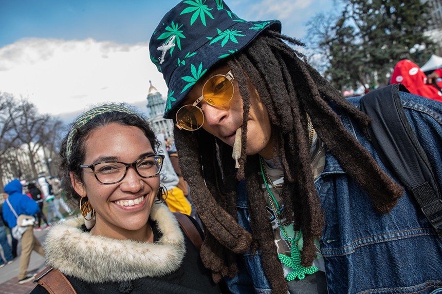Attendees light up at the Mile High 420 Festival
