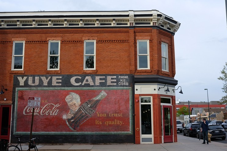 Restaurant building with old fashioned mural ad