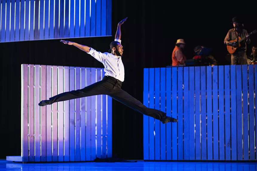 a man dancing on stage
