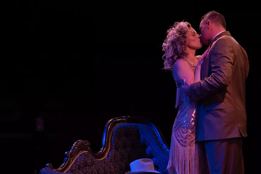 man and woman kissing