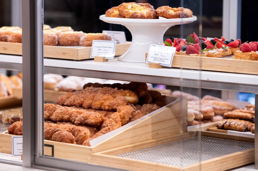close up of pastries and cakes in a case