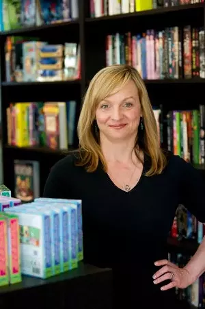 woman in front of bookshelf