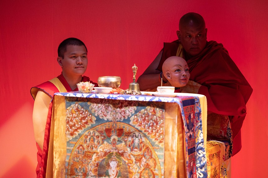 two monks at an altar